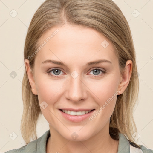 Joyful white young-adult female with medium  brown hair and green eyes