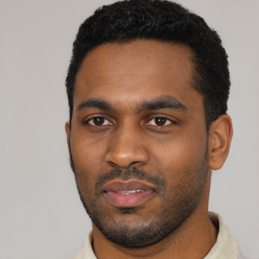 Neutral black young-adult male with short  black hair and brown eyes