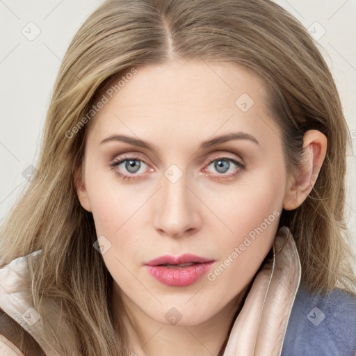 Joyful white young-adult female with long  brown hair and blue eyes