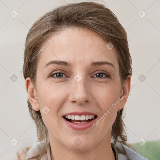 Joyful white young-adult female with medium  brown hair and grey eyes