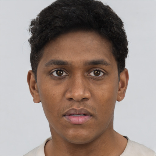Neutral black young-adult male with short  brown hair and brown eyes