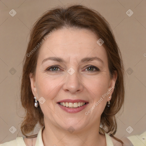 Joyful white adult female with medium  brown hair and brown eyes