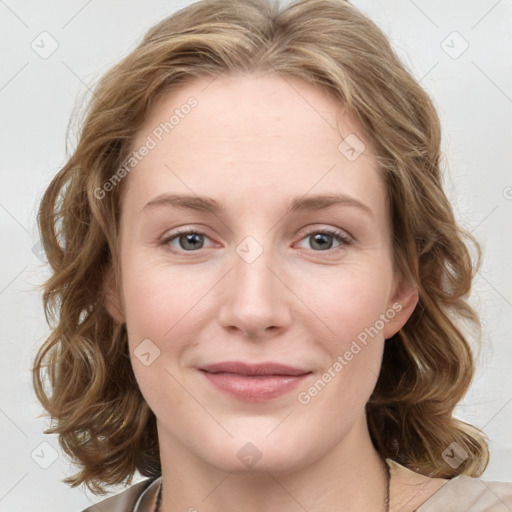 Joyful white young-adult female with medium  brown hair and blue eyes