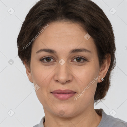 Joyful white adult female with short  brown hair and brown eyes