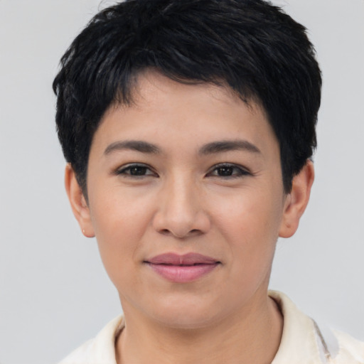 Joyful asian young-adult female with short  black hair and brown eyes