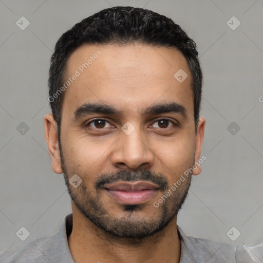 Joyful latino young-adult male with short  black hair and brown eyes