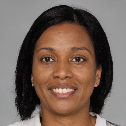 Joyful asian adult female with medium  black hair and brown eyes