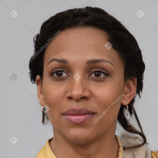 Joyful latino adult female with short  brown hair and brown eyes