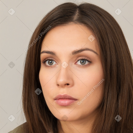 Neutral white young-adult female with long  brown hair and brown eyes