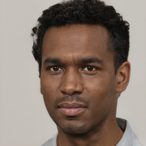 Neutral black young-adult male with short  black hair and brown eyes