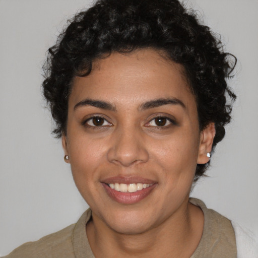 Joyful latino young-adult female with short  brown hair and brown eyes