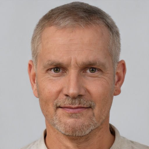 Neutral white middle-aged male with short  gray hair and brown eyes