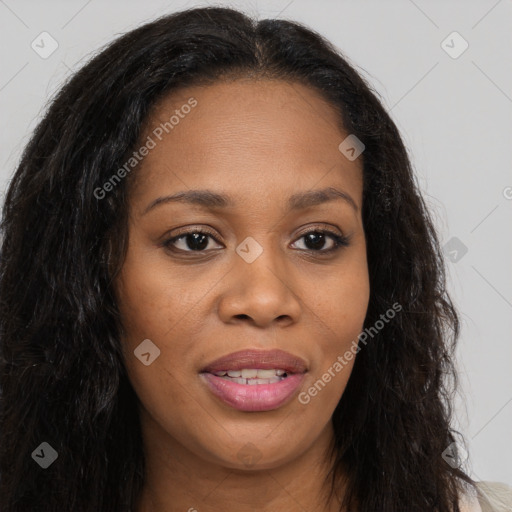 Joyful black young-adult female with long  brown hair and brown eyes