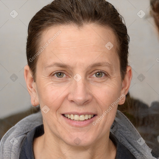 Joyful white adult female with short  brown hair and brown eyes