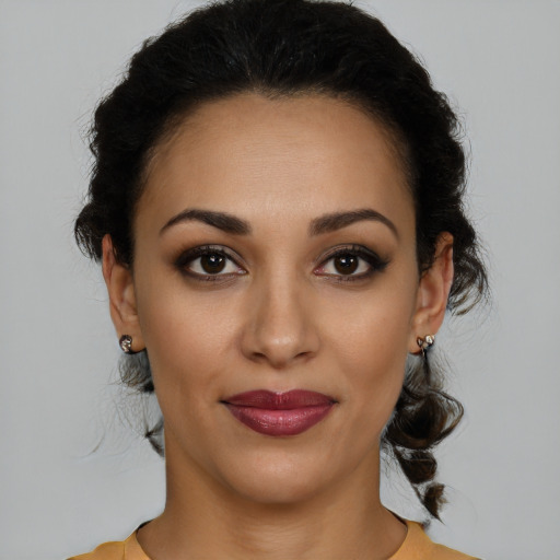 Joyful latino young-adult female with medium  brown hair and brown eyes