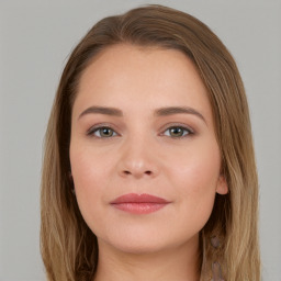 Joyful white young-adult female with long  brown hair and grey eyes