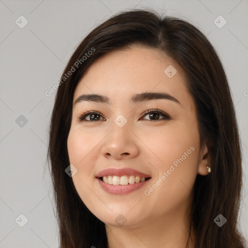 Joyful white young-adult female with long  brown hair and brown eyes