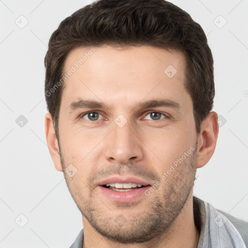 Joyful white young-adult male with short  brown hair and brown eyes