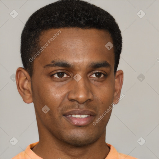 Joyful black young-adult male with short  brown hair and brown eyes