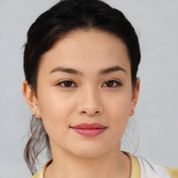 Joyful asian young-adult female with short  brown hair and brown eyes