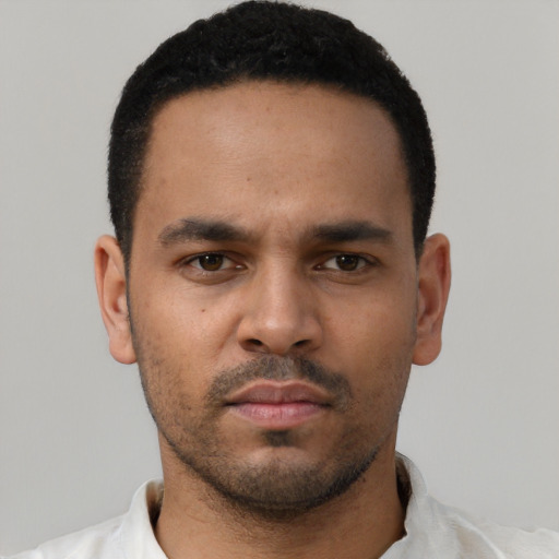 Neutral latino young-adult male with short  black hair and brown eyes