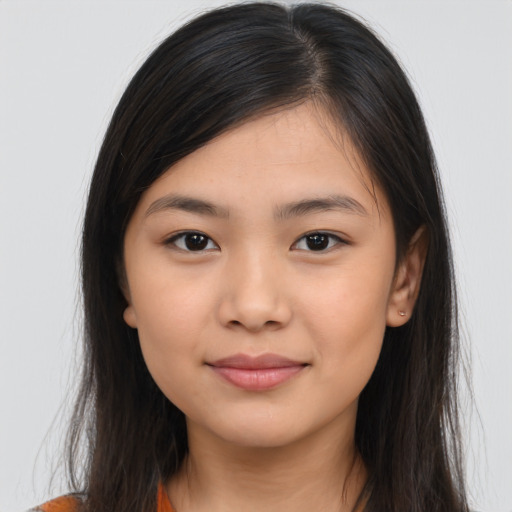 Joyful asian young-adult female with long  brown hair and brown eyes