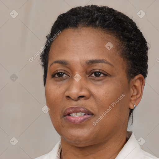 Joyful black adult female with short  brown hair and brown eyes