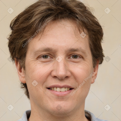 Joyful white adult male with short  brown hair and grey eyes