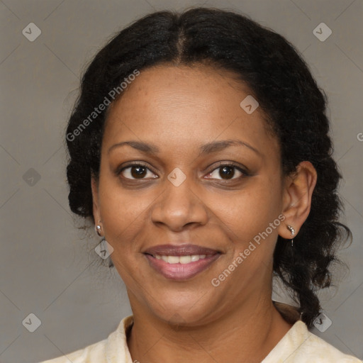 Joyful black adult female with medium  brown hair and brown eyes