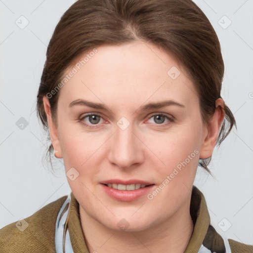 Joyful white young-adult female with medium  brown hair and blue eyes