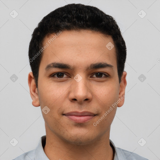 Joyful latino young-adult male with short  brown hair and brown eyes