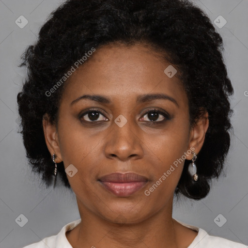 Joyful black adult female with short  brown hair and brown eyes