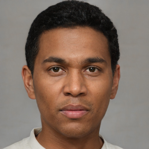 Neutral black young-adult male with short  black hair and brown eyes