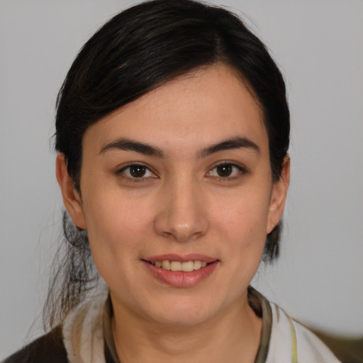 Joyful white young-adult female with medium  brown hair and brown eyes