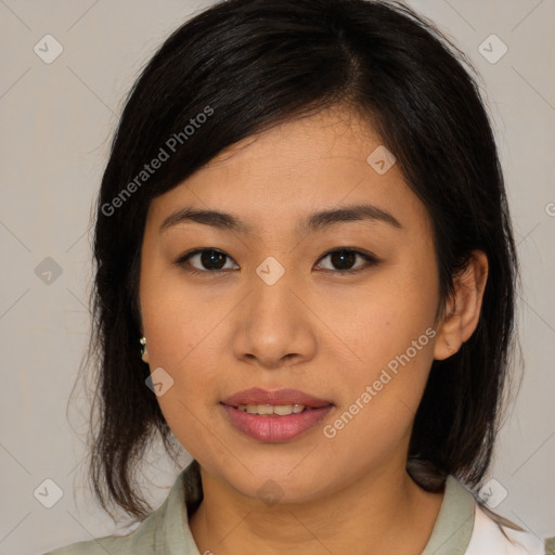 Joyful asian young-adult female with medium  brown hair and brown eyes