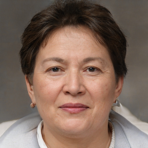 Joyful white adult female with short  brown hair and brown eyes