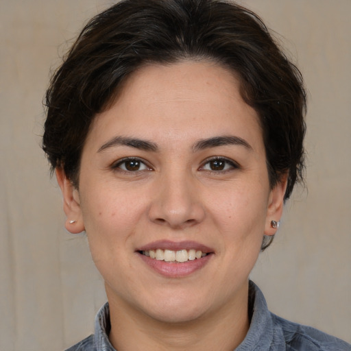 Joyful white young-adult female with medium  brown hair and brown eyes