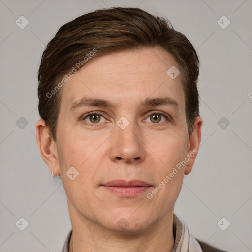 Joyful white adult male with short  brown hair and grey eyes