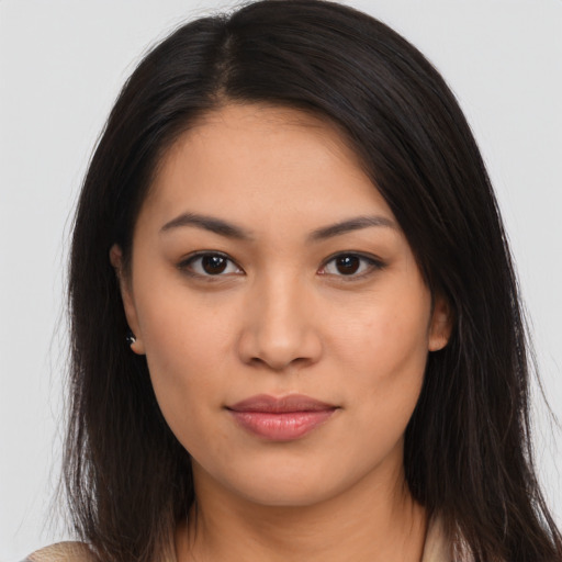 Joyful asian young-adult female with long  brown hair and brown eyes