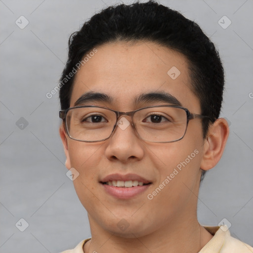 Joyful asian young-adult male with short  brown hair and brown eyes