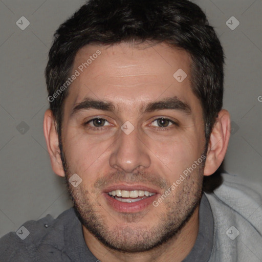 Joyful white adult male with short  brown hair and brown eyes