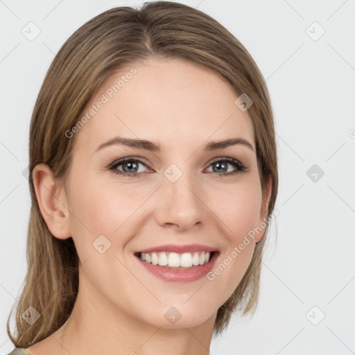 Joyful white young-adult female with medium  brown hair and green eyes