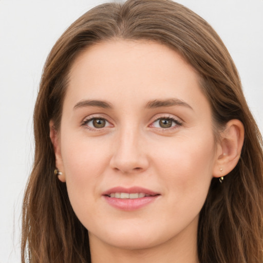 Joyful white young-adult female with long  brown hair and grey eyes