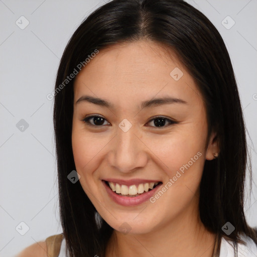 Joyful asian young-adult female with medium  brown hair and brown eyes