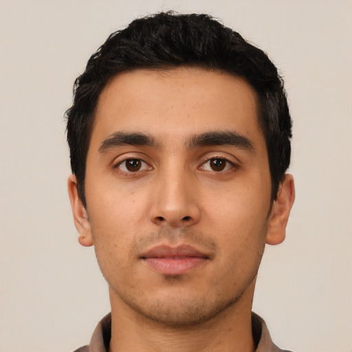 Neutral latino young-adult male with short  black hair and brown eyes