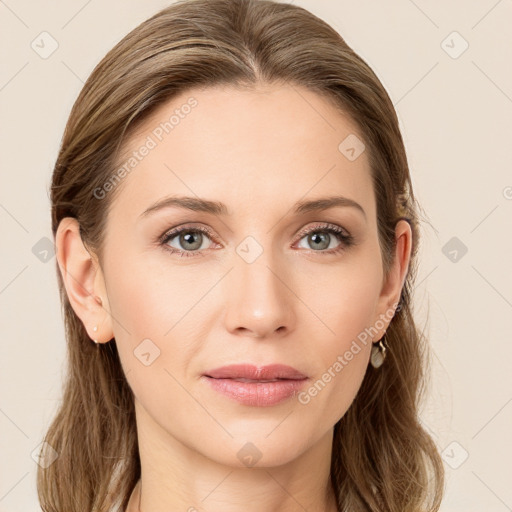 Joyful white young-adult female with long  brown hair and blue eyes