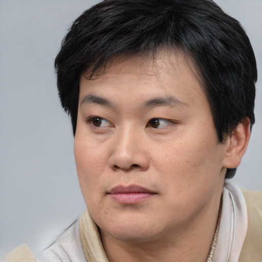 Neutral asian young-adult male with short  brown hair and brown eyes