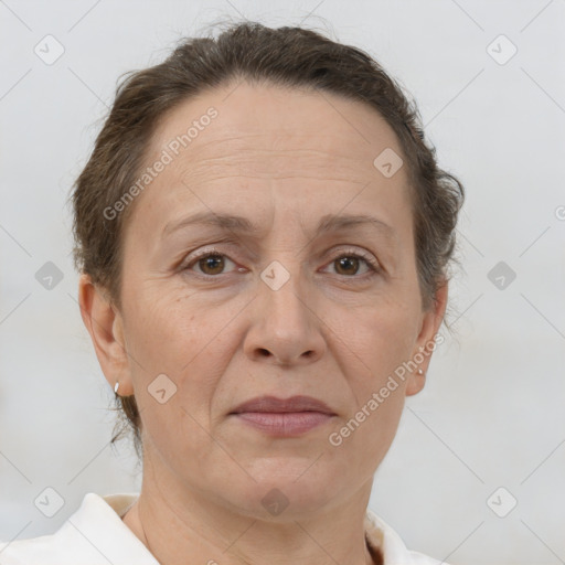 Joyful white adult female with short  brown hair and brown eyes