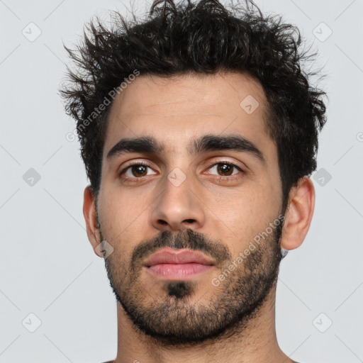 Neutral white young-adult male with short  black hair and brown eyes