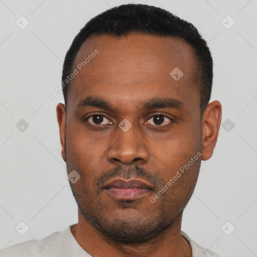 Neutral latino young-adult male with short  black hair and brown eyes